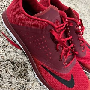 Red Nike tennis shoes